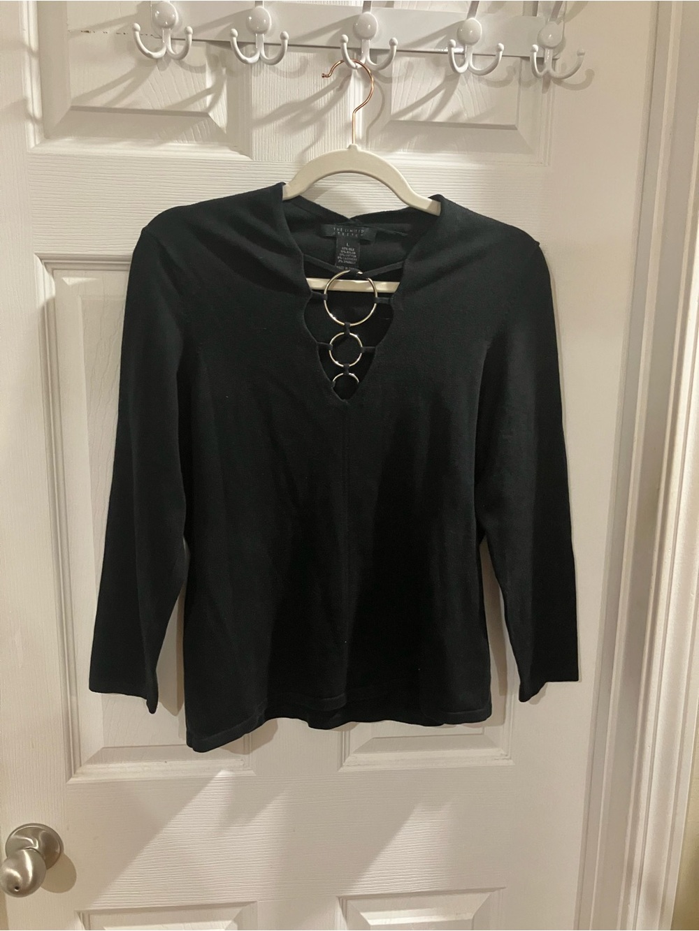 The Limited Black Long Sleeve Top with Front Ring Accents